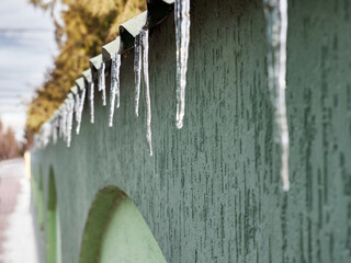 Heated icicles melt and drip water.