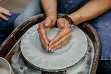 Modeling clay on a potter's wheel