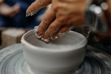 Fototapeta na wymiar Modeling clay on a potter's wheel