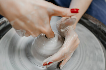 Modeling clay on a potter's wheel