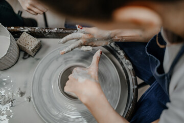 Modeling clay on a potter's wheel