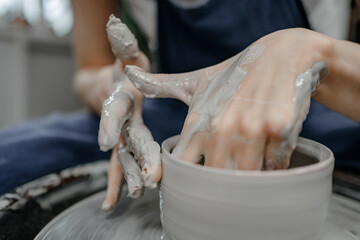 Modeling clay on a potter's wheel