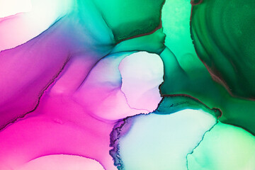 Abstract fluid art painting background in alcohol ink technique, mixture of magenta, purple and green paints. Transparent overlayers of ink create glowing golden veins and gradients.