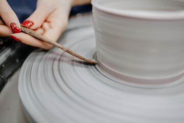 Modeling clay on a potter's wheel