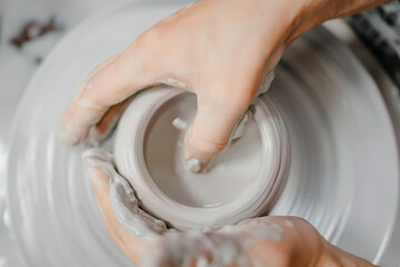 Modeling clay on a potter's wheel