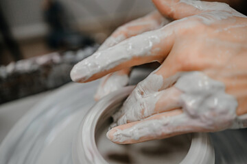 Modeling clay on a potter's wheel