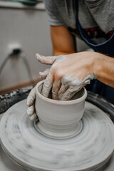 Modeling clay on a potter's wheel