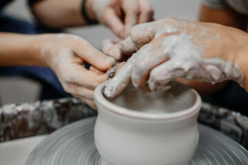 Modeling clay on a potter's wheel
