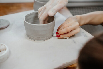 Modeling clay on a potter's wheel
