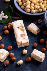 Soft nougats with hazelnuts on rustic table