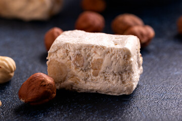Soft nougats with hazelnuts on rustic table