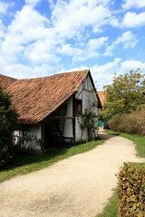 Fototapeta na wymiar traditional white barn in a rural landscape, Bokrijk, Belgium