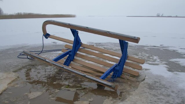 Wooden Sled on Thin Ice Lake, Danger of Drowning in Ice-Hole in Winter