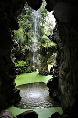 Grotto and waterfall - obrazy, fototapety, plakaty