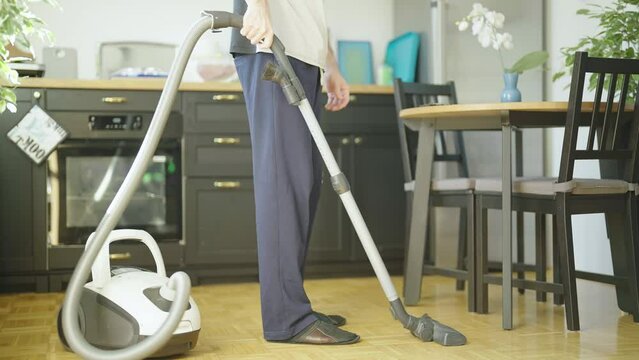 Person doing housework with vacuum cleaner and vacuuming own fart 4K