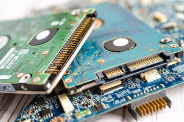 Technician repairing inside of mobile phone by soldering iron. Integrated Circuit. the concept of...