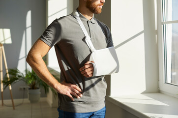 Orthopedic emergency. Injured man who during rehabilitation at home wearing medical support brace...