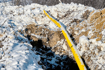 Gas pipe is covered with snow.
