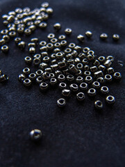 mscro black shiny beads on dark backgrond