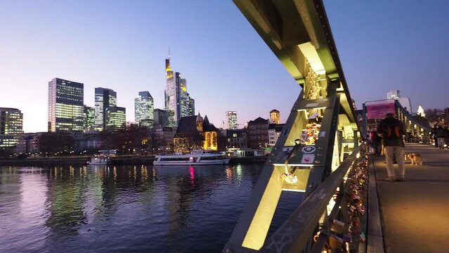 View from Eiserner Steg / The Iron Bridge on Main River to the business centre of the city Frankfurt, July 2019