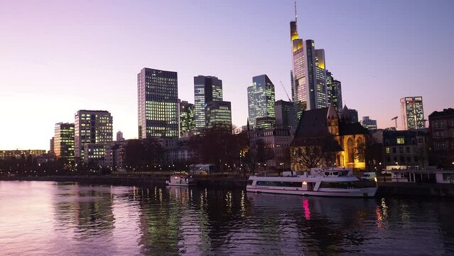 View from Eiserner Steg / The Iron Bridge on Main River to the business centre of the city Frankfurt, July 2019