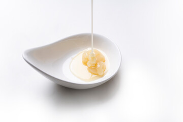 condensed milk isolated on a white background, food and dessert concept