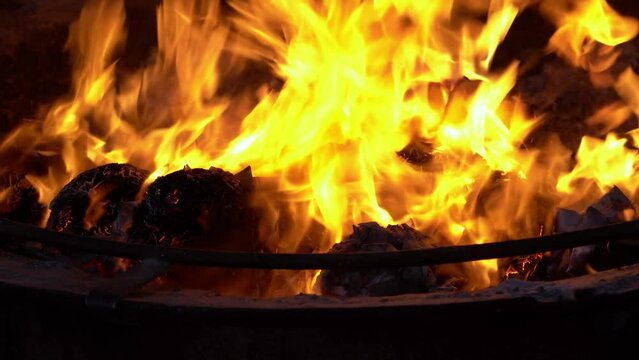 Burning furnace of joss paper offering to deity at Chinese temple