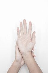 Pale palmar surface of both hands. Anaemic hands of Asian, Chinese man.