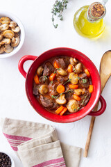 Beef bourguignon stew with carrots and mushrooms. French cuisine.