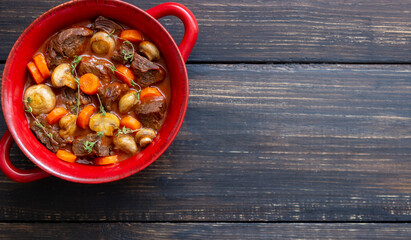 Beef bourguignon stew with carrots and mushrooms. French cuisine.