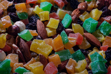 The concept of a healthy breakfast of dried fruits and nuts. Close-up of colorful veggie food snack