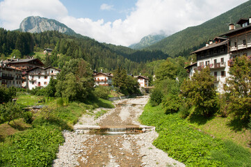 Fototapeta na wymiar Alpine Stream in Dolomites. Forni di Sopra, Italy