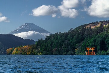 Beautiful autumn scene of Mt. Fuji from Lake Ashinoko with a red Tori gate, Hakone, Japan
