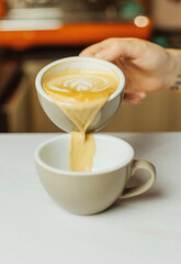 Hot beverage in the cafeteria. Tasty cappuccino in the cafe