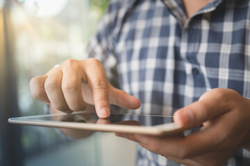 Close up hands of man handsome using smart phone in coffee shop cafe.