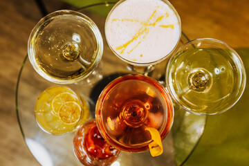 Macro image of cocktails and glasses of wine. 