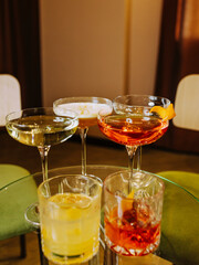 Macro image of cocktails and glasses of wine. 