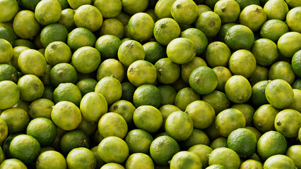 Viele grüne frische Limonen als Hintergrund Textur