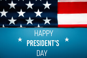 Obraz na płótnie Canvas National holidays of United States of America. Happy president's day with flag of the USA on blue background. Flat lay