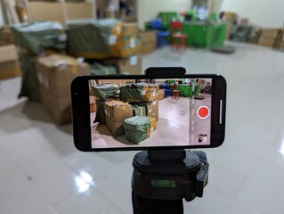 An iPhone on a tripod recoding a video 