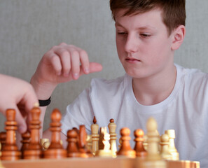 teenager playing chess