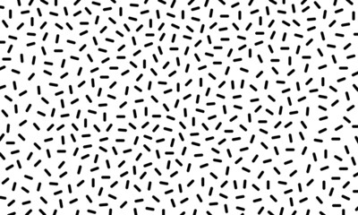 Black capsule shaped scattered pattern on white background vector