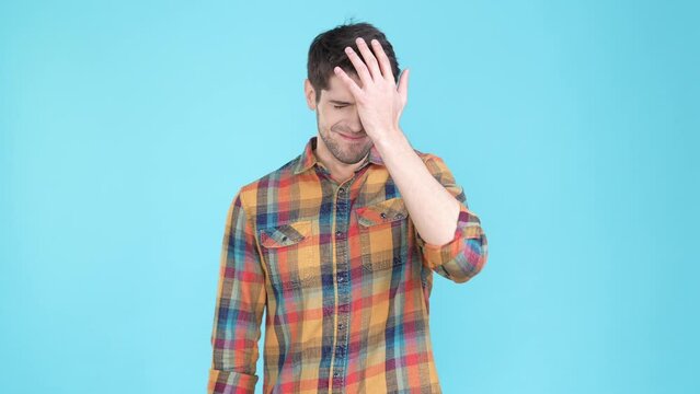 Displeased guy forget girlfriend anniversary isolated blue color background