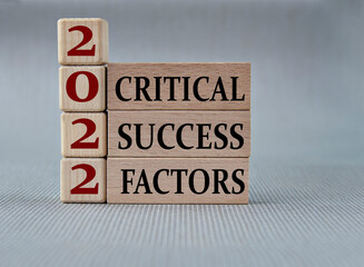CRITICAL SUCCESS TACTORS 2022 - words on wooden blocks on gray background
