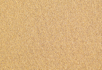 Fototapeta na wymiar Sand texture. Top view summer coarse sea sand background