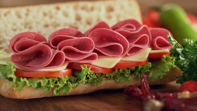 Image of delicious sandwich.A beef salami sandwich is served at the dinner table. A nice sandwich with salami is ready to eat.
