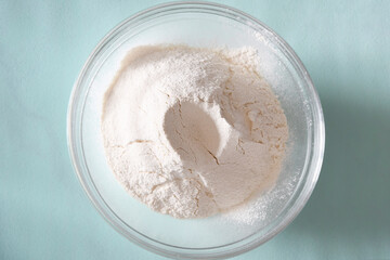 wheat flour in a bowl, the first ingredient and step in making homemade cakes