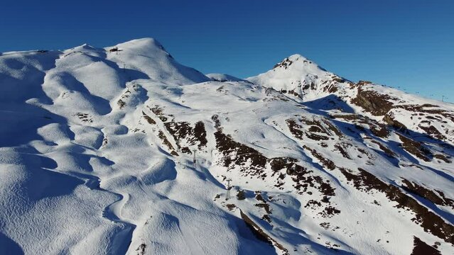 Aerial drone footage of the Jungfrau region ski resort near the Kleine Scheidegg train station in the Berner Oberland alps near Interlaken in Switzerland