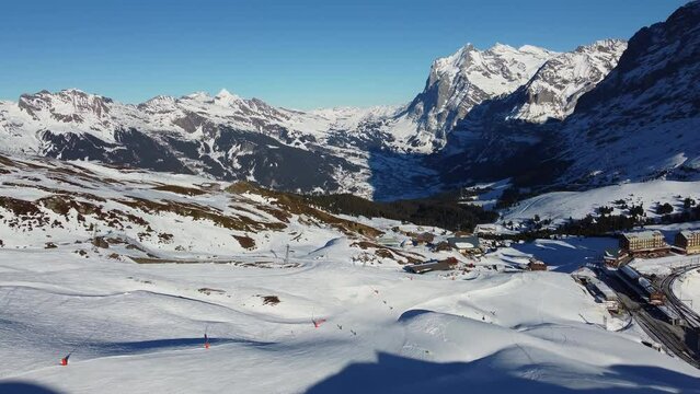 Aerial drone footage of the Jungfrau region ski resort near the Kleine Scheidegg train station in the Berner Oberland alps near Interlaken in Switzerland