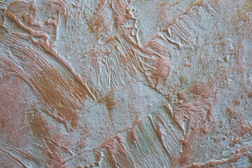 Stucco wall with gold paint